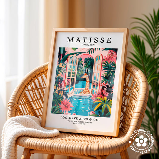 A framed poster of a giraffe in a tropical setting, with a wicker chair and a plant in the background.