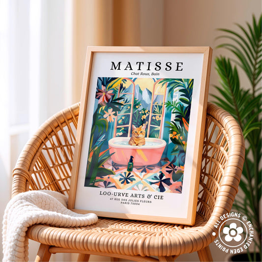 A framed poster of a cat sitting in a bathtub, surrounded by tropical plants, is displayed on a wicker chair.