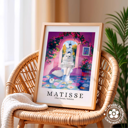 A framed print of a whimsical illustration depicting a cat sitting on a toilet in a colorful, floral-adorned bathroom.