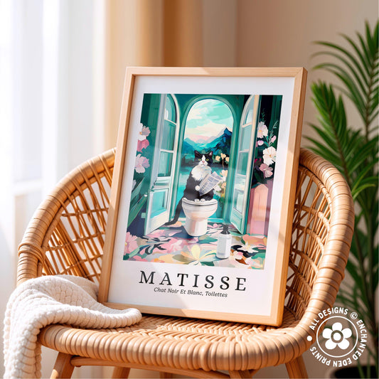 A framed print of a colorful illustration depicting a cat sitting on a toilet in a bathroom, with a floral pattern on the floor and a window with an open door in the background.