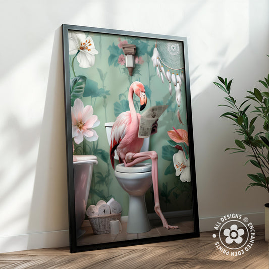 A framed illustration depicting a pink flamingo sitting on a toilet and reading a newspaper, surrounded by flowers and a dreamcatcher.