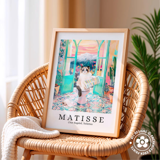 A framed print of a cat sitting on a toilet in a colorful, whimsical setting, with the text "MATISSE" and "Chat Ragdoll, Tobacco" below it.