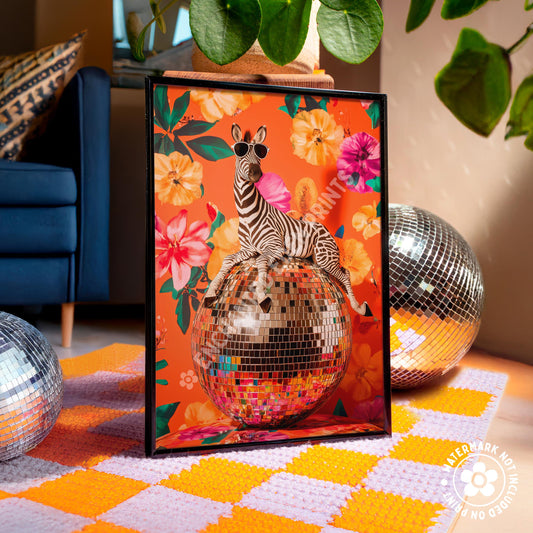 a picture of a zebra sitting on top of a disco ball