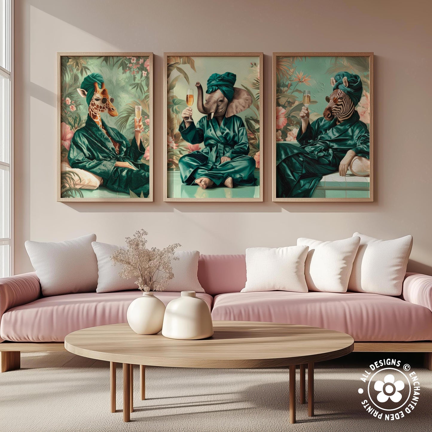 a cozy living room with a pink sofa and a wooden coffee table. Above the sofa, there are three framed pictures depicting animals dressed in green robes, each holding a drink.