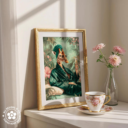 a framed painting of a giraffe wearing a green robe, sitting on a bench surrounded by flowers, with a cup of tea and a vase of pink flowers on a white shelf.