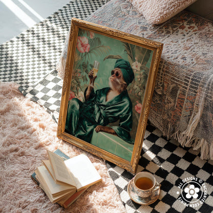 a framed painting of a cat wearing a green robe and holding a glass of wine, sitting on a pink shag rug next to a stack of books and a cup of tea.