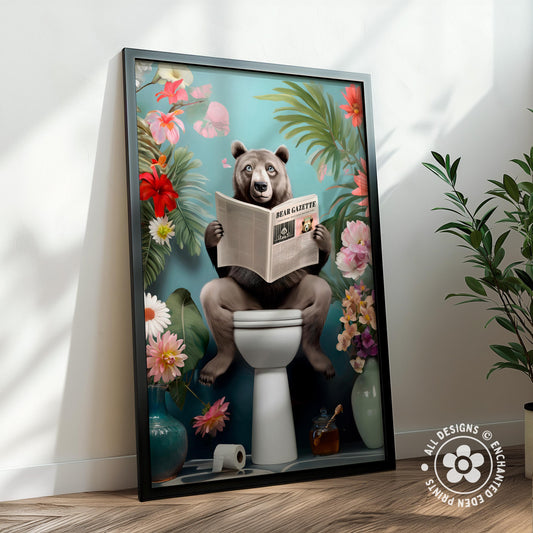A framed illustration depicting a bear sitting on a toilet surrounded by flowers and plants, reading a newspaper.
