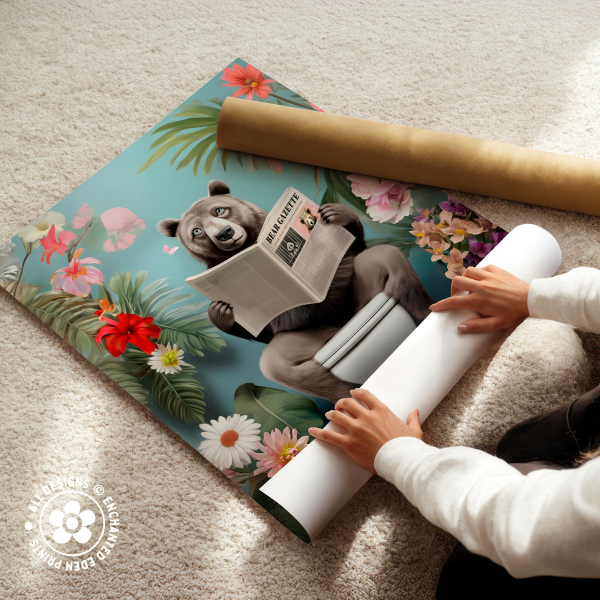 A person is holding a roll of paper and appears to be unfolding a poster featuring a cartoon image of a bear reading a newspaper.