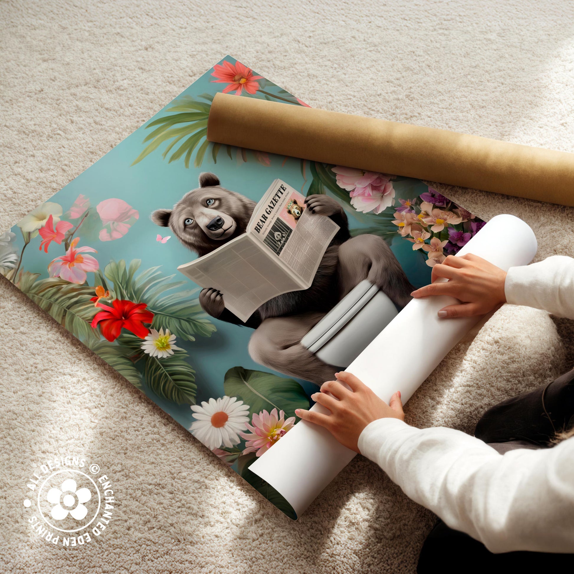 A person is holding a roll of paper and appears to be unfolding a poster featuring a cartoon image of a bear reading a newspaper.