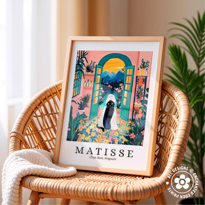 A framed poster of a colorful, whimsical illustration of a woman in a hat and dress, surrounded by tropical plants and flowers, is displayed on a wicker chair.
