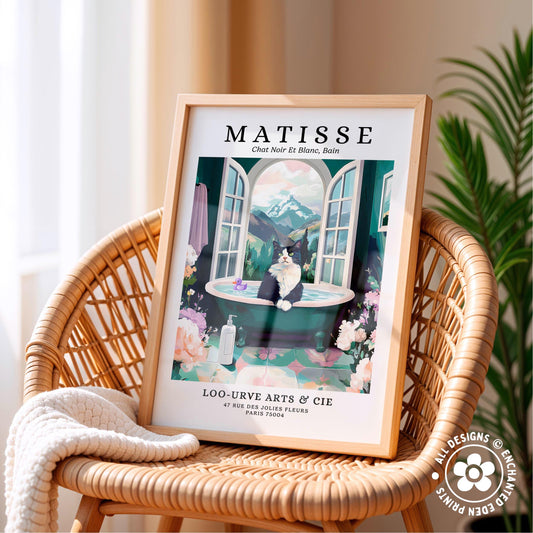 A framed poster of a cat sitting in a bathtub, surrounded by flowers, is displayed on a wicker chair.