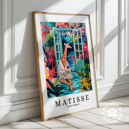 A framed poster depicting a giraffe sitting in a tropical garden, with colorful foliage and flowers surrounding it.