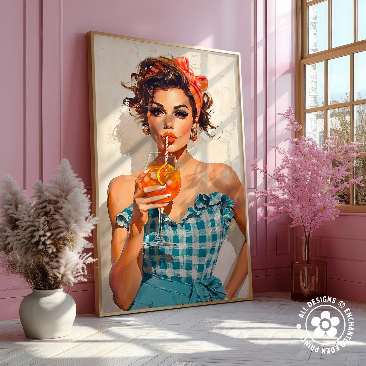 A framed illustration of a woman in a blue and white checkered dress holding a drink, with a pink wall and a window in the background.