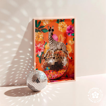 a disco ball and a zebra in a picture frame