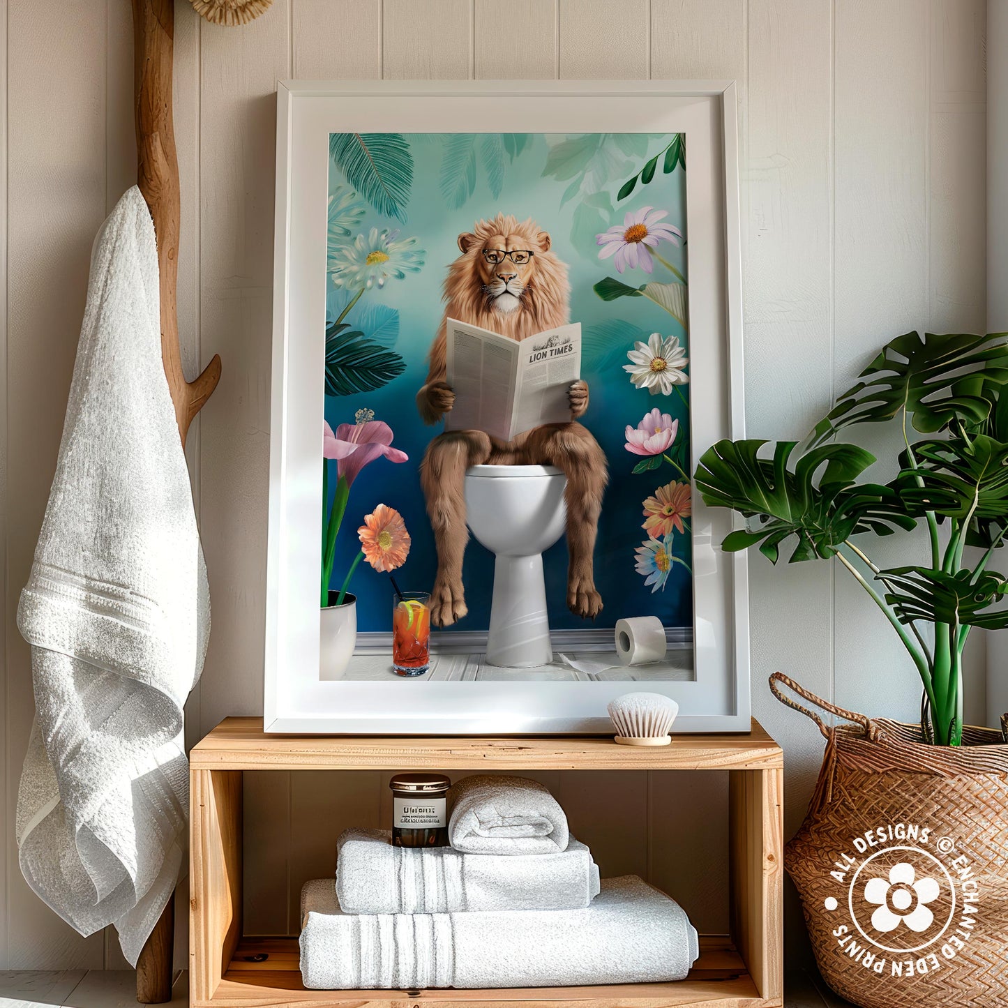 a framed painting of a lion sitting on a toilet and reading a book, surrounded by flowers and plants.