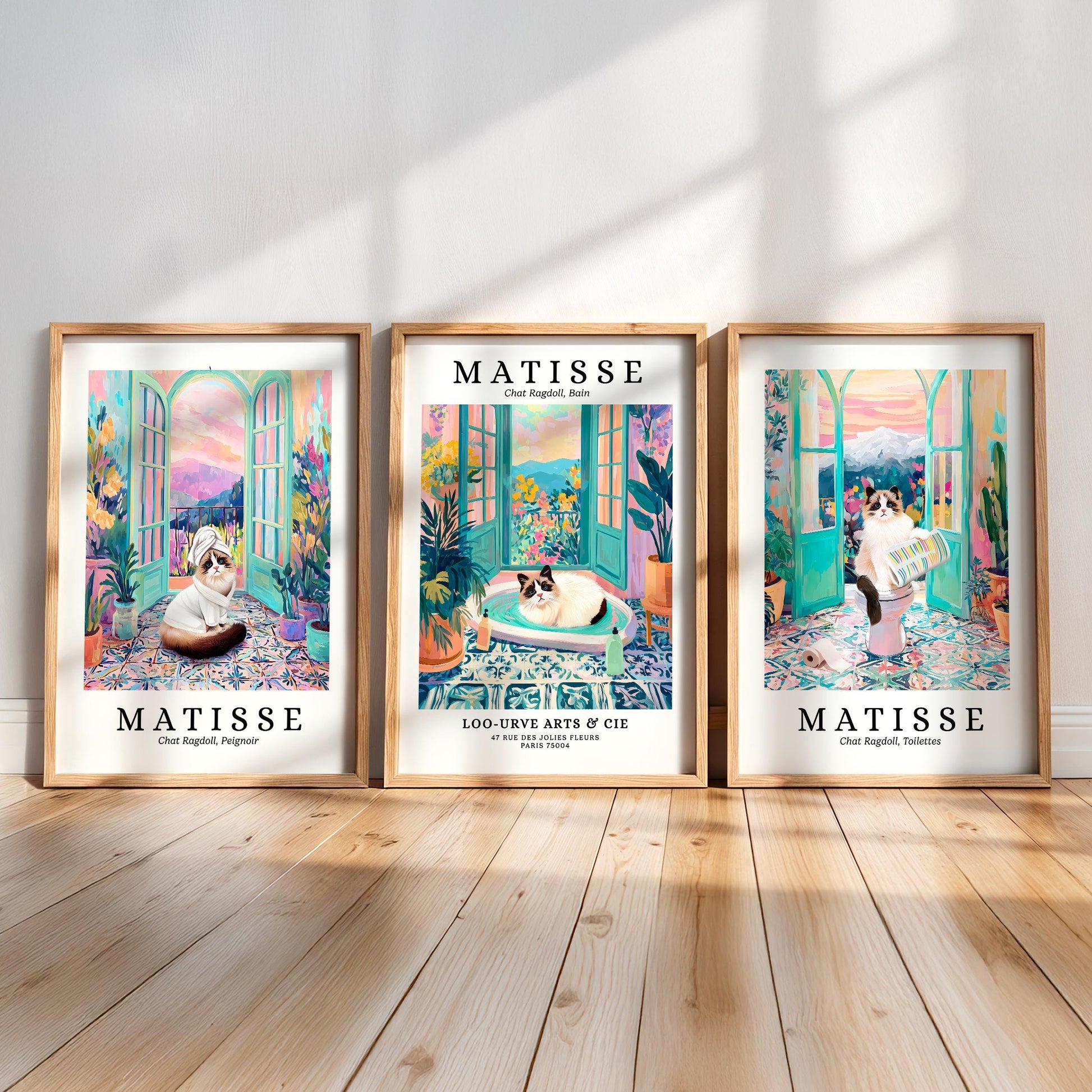 three framed prints of the famous French artist Matisse, each depicting a cat in a different scene.