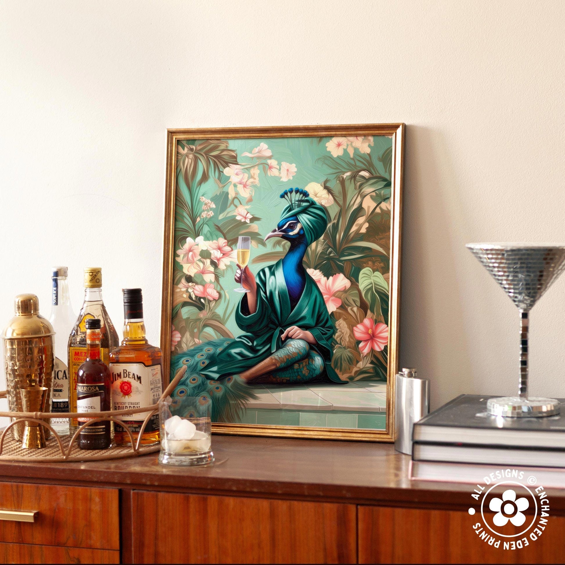 a framed painting of a peacock holding a glass of wine, surrounded by a lush, tropical garden scene.