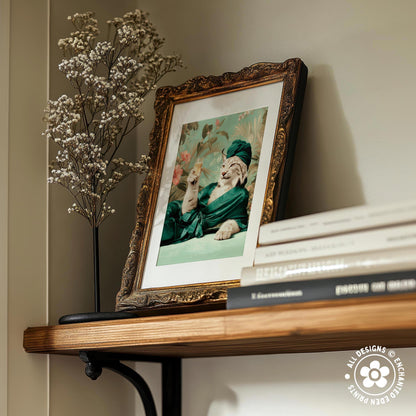 a wooden shelf with a framed picture of a cat wearing a green outfit, a vase of white flowers, and a stack of books.