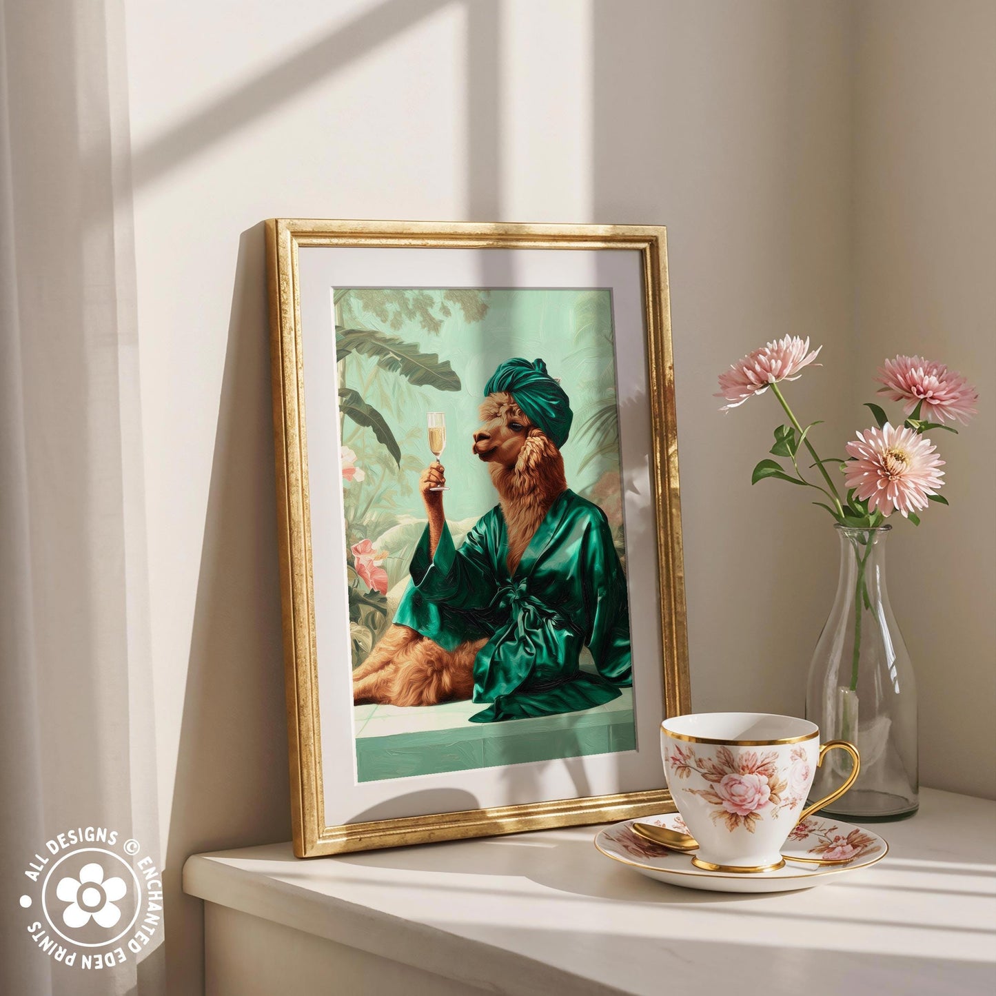 a framed painting of a cat in a green robe, sitting on a table next to a vase of pink flowers and a cup of tea.