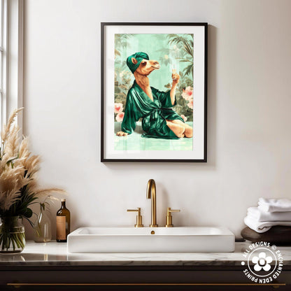 a framed painting of a camel wearing a green robe and holding a wine glass, sitting on a green surface with a gold faucet in the foreground.