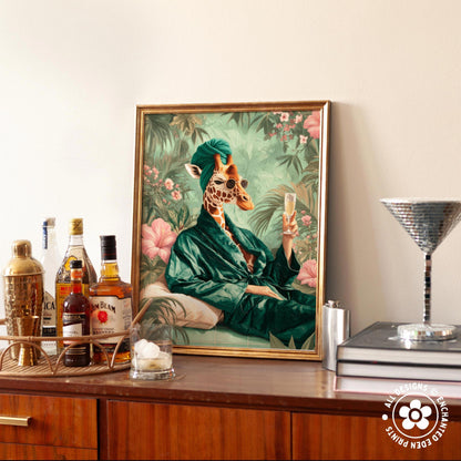 a framed painting of a giraffe wearing a green robe and holding a glass of champagne, surrounded by a tropical garden scene.