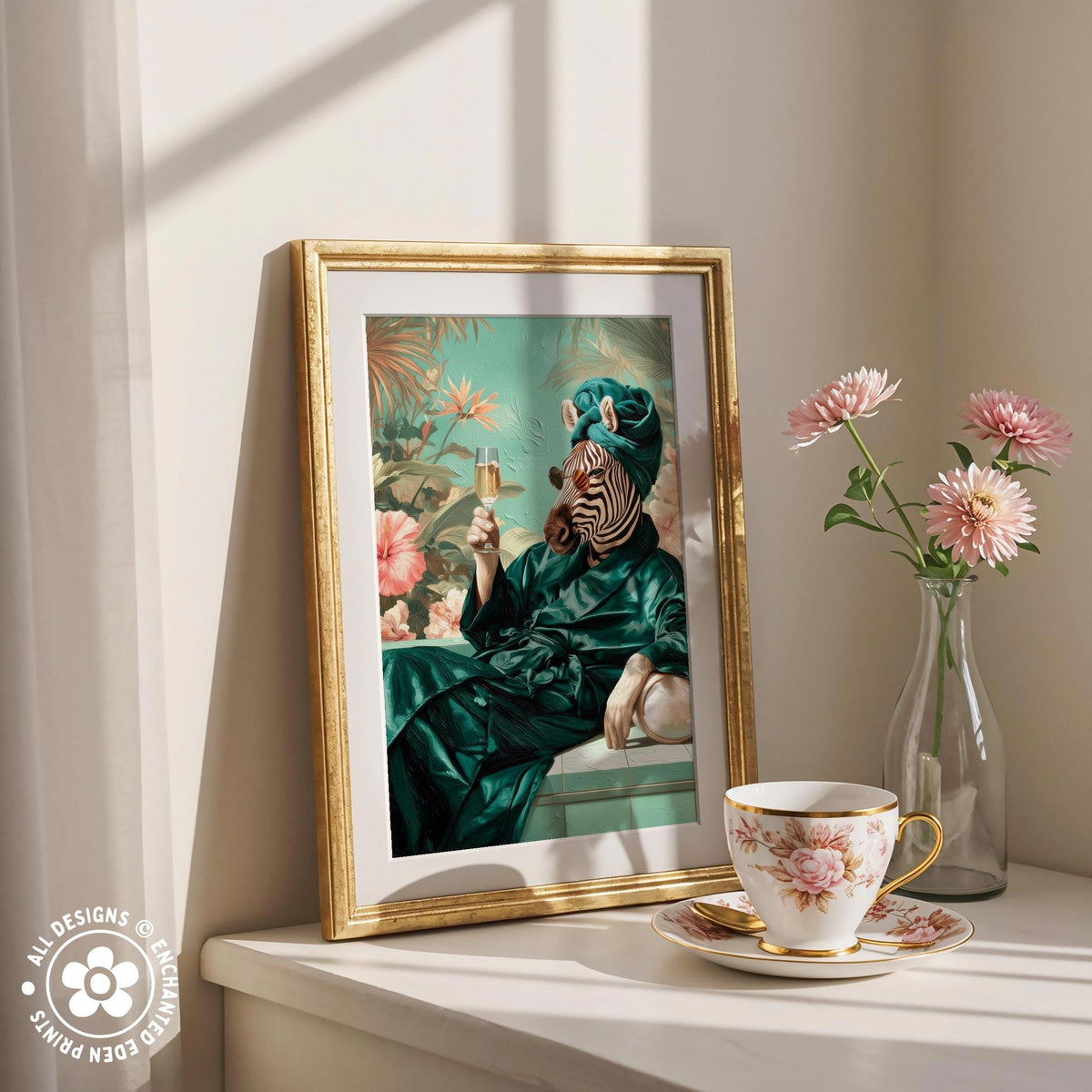 a framed painting of a zebra wearing a green robe and holding a drink, placed on a white shelf next to a vase of pink flowers and a teacup.