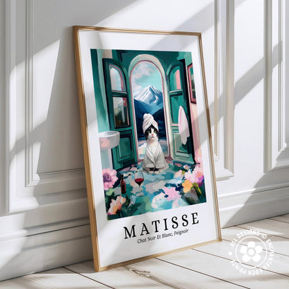 A framed poster depicting a cat in a bathroom, with a towel wrapped around its head and a bottle of wine on the floor.