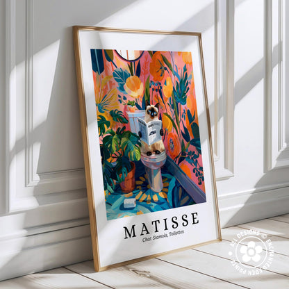 A framed poster depicting a cat sitting on a toilet in a colorful, abstract floral and tropical setting, with the text "MATISSE" below the artwork.