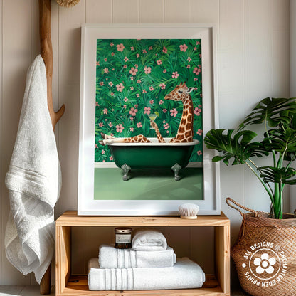 A framed painting of a giraffe sitting in a bathtub surrounded by a lush green floral background, with a wooden shelf below holding folded towels and a woven basket to the right.