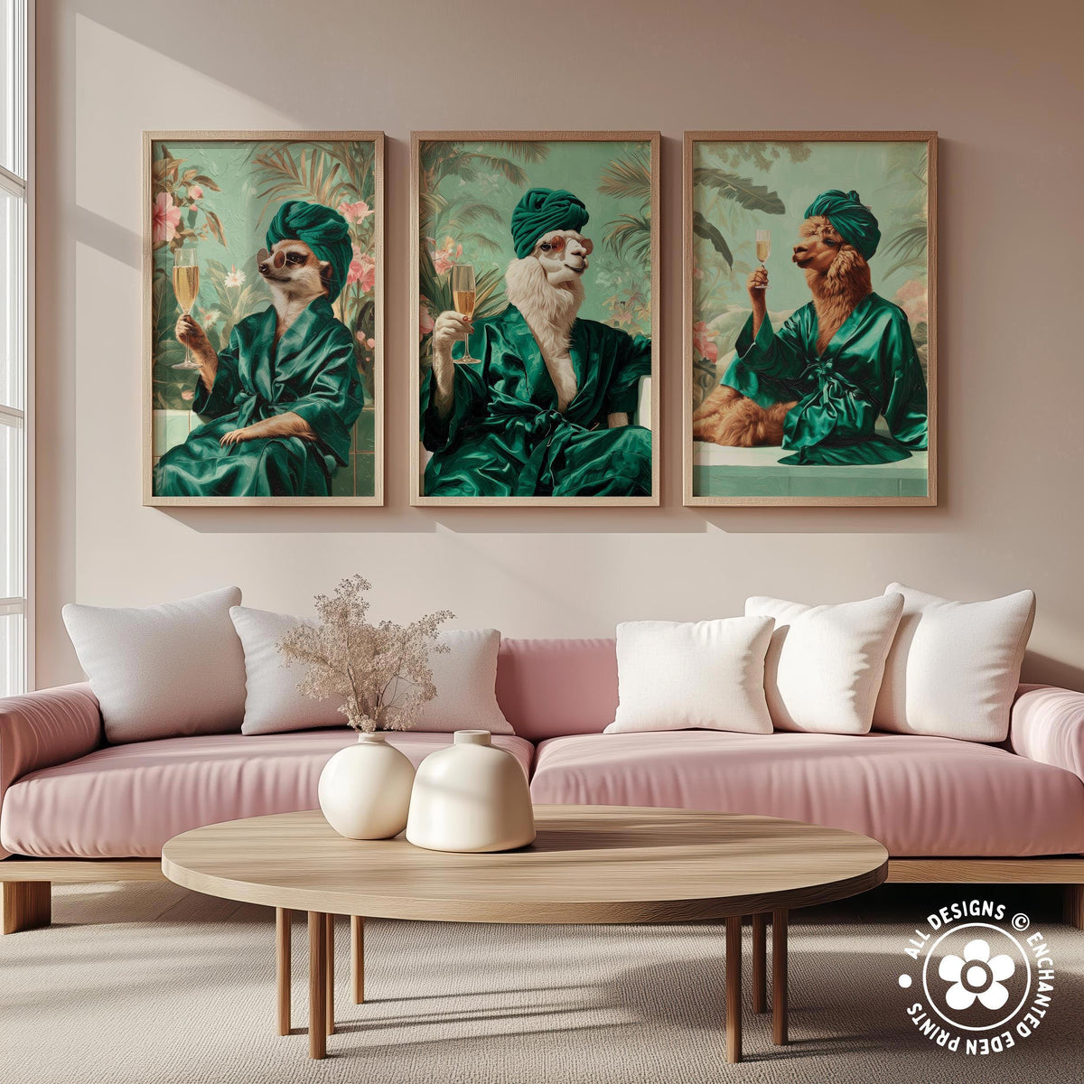 a cozy living room with a pink sofa and a wooden coffee table. Above the sofa, there are three framed pictures of cats dressed in green robes, each holding a wine glass. The cats appear to be enjoying a luxurious spa-like experience.