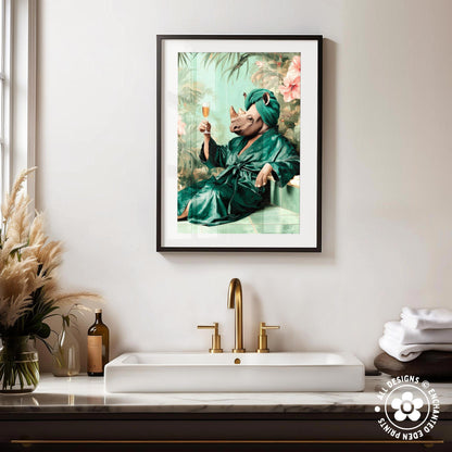 a framed painting of a rhinoceros wearing a green robe and holding a glass of wine, sitting on a bench in a tropical setting.