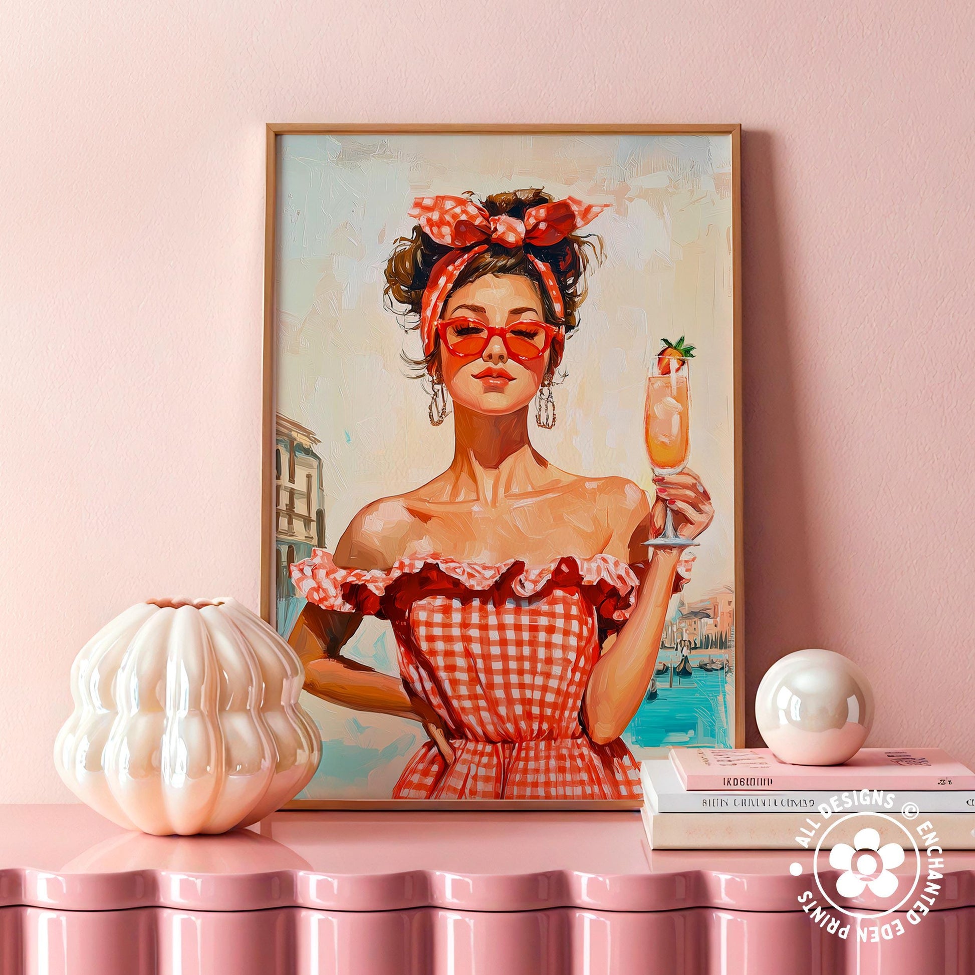 a framed painting of a woman in a red and white checkered dress holding a drink, with a pink wall in the background.