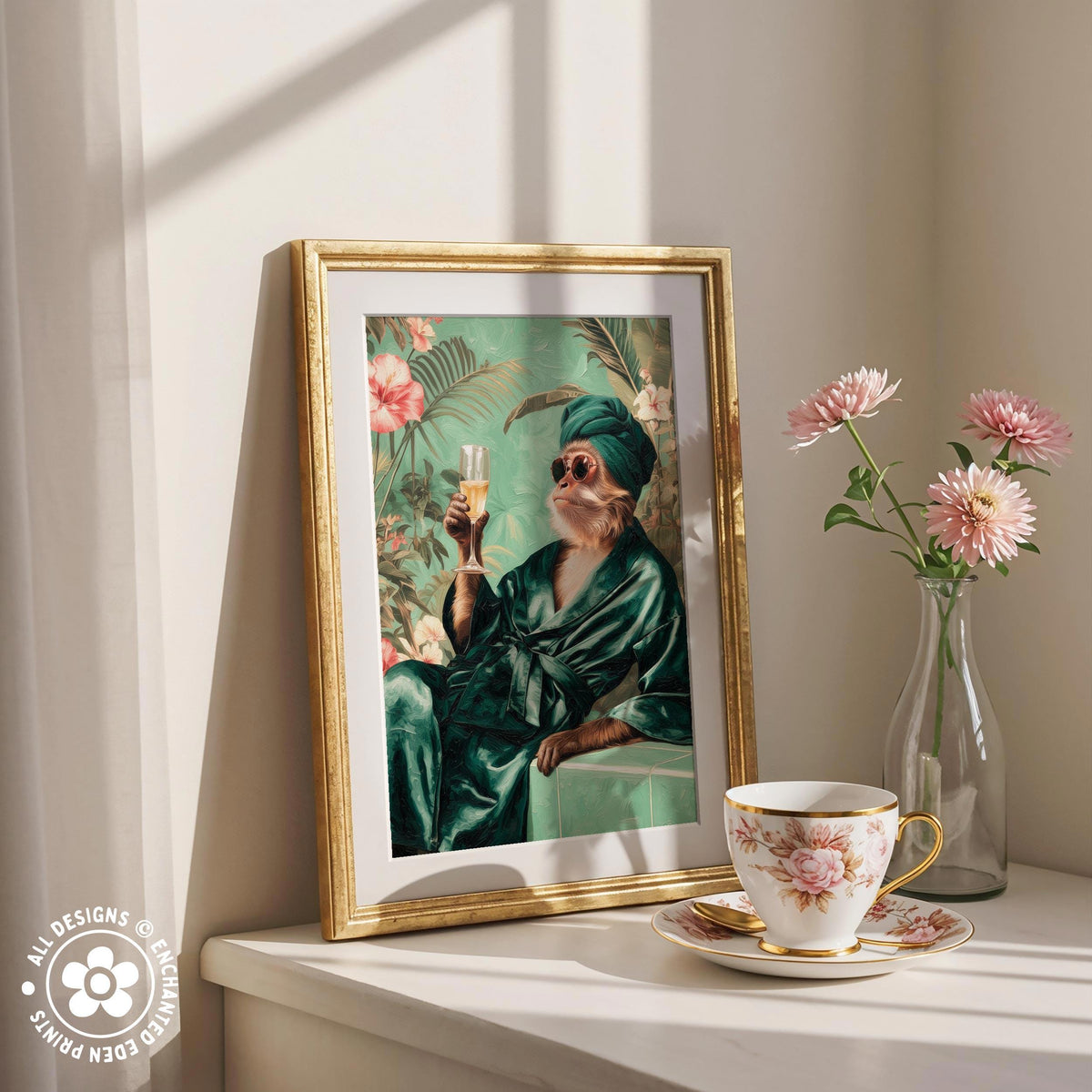 a framed painting of a person in a green robe holding a glass of wine, surrounded by pink flowers and a vase of pink flowers on a white shelf.