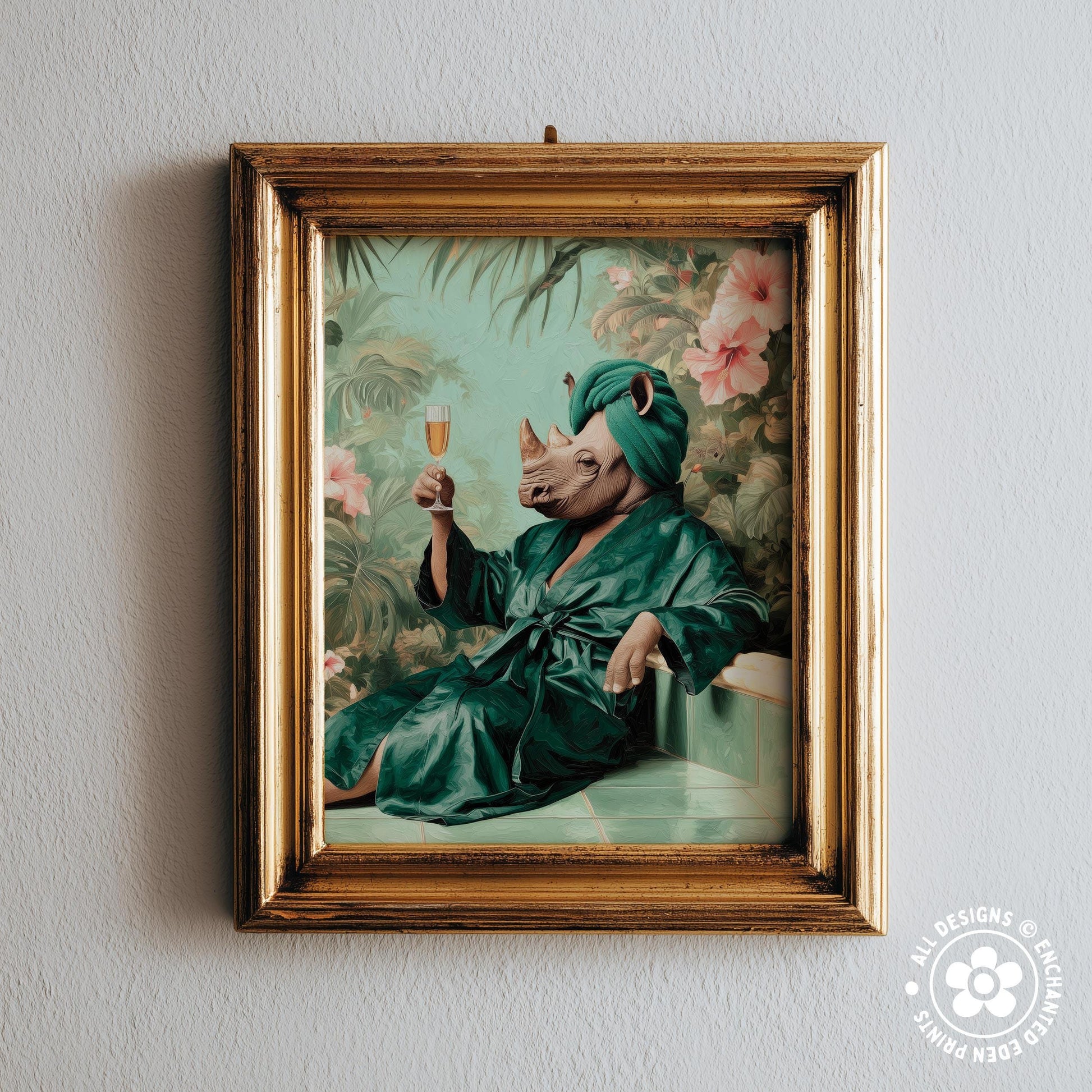 A framed print depicting a rhinoceros wearing a green bathrobe and holding a glass of champagne, surrounded by tropical foliage.