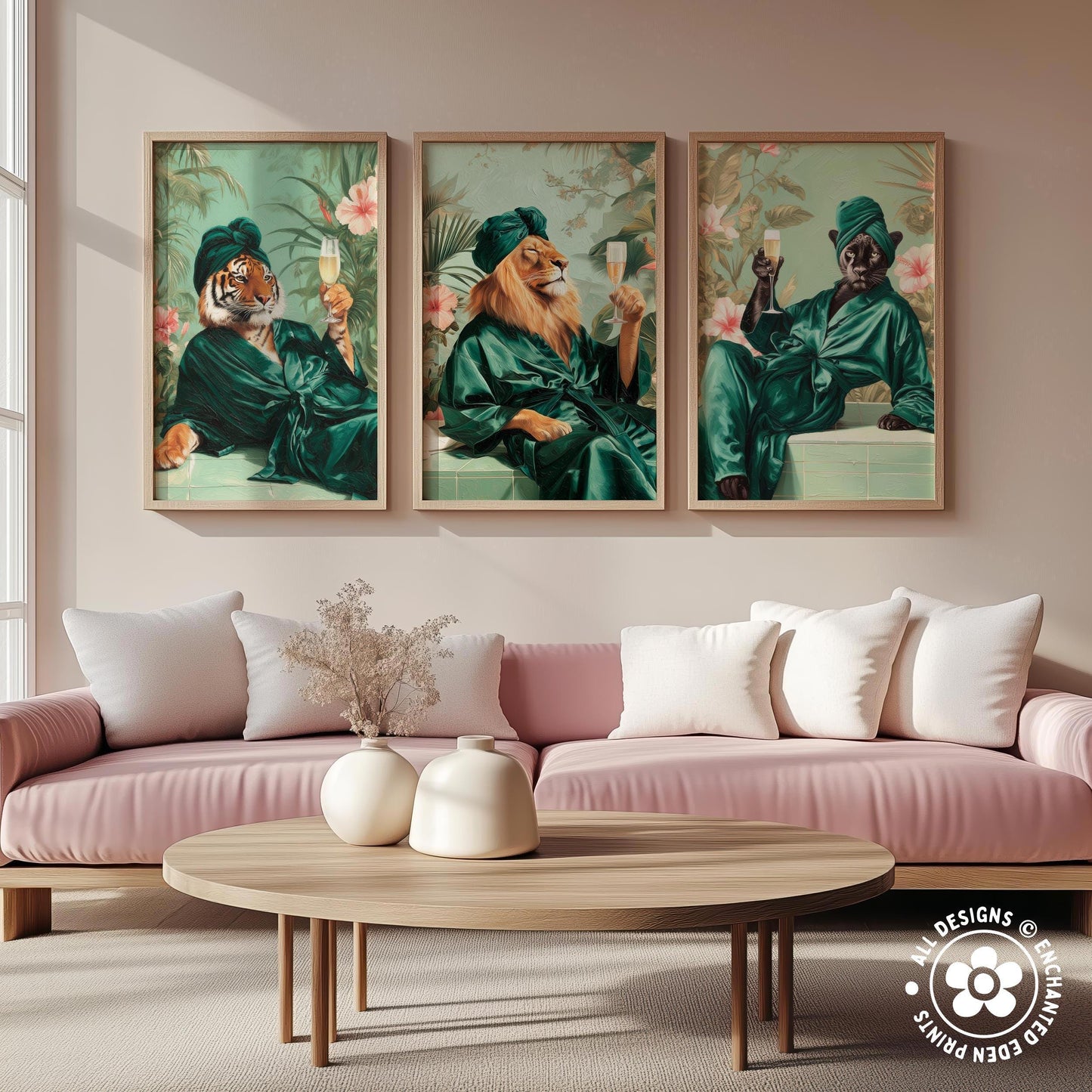 a living room with a pink sofa and a wooden coffee table. Above the sofa, there are three framed paintings depicting animals in green robes, each holding a wine glass.