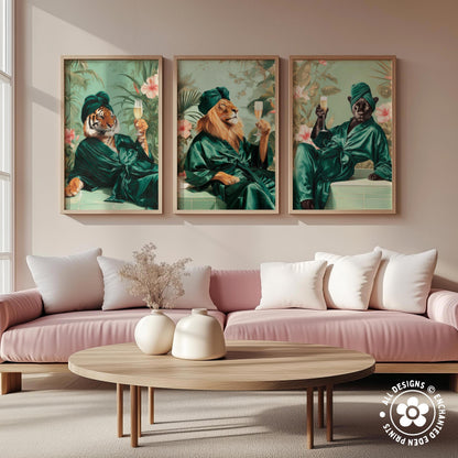 a living room with a pink sofa and a wooden coffee table. Above the sofa, there are three framed paintings depicting animals in green robes, each holding a wine glass.