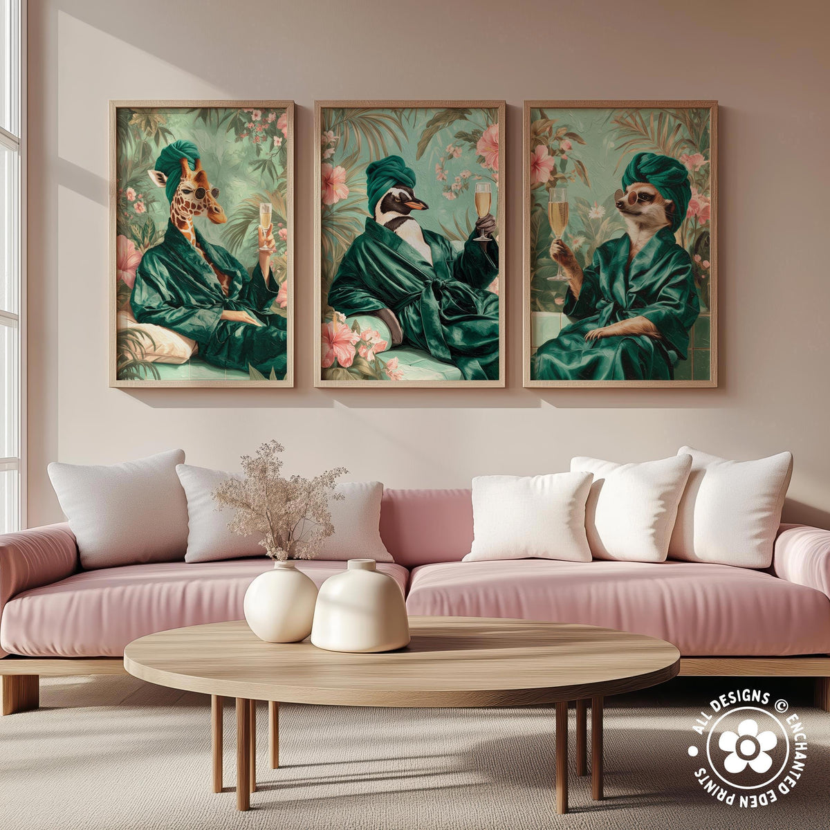 a cozy living room with a pink sofa and a wooden coffee table. Above the sofa, there are three framed pictures of animals, including a giraffe, a penguin, and a cat, all dressed in green robes and holding drinks.