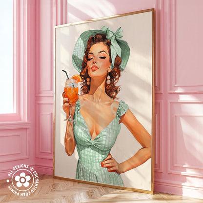 A framed illustration of a woman in a green dress holding a drink, with a pink wall and a window in the background.