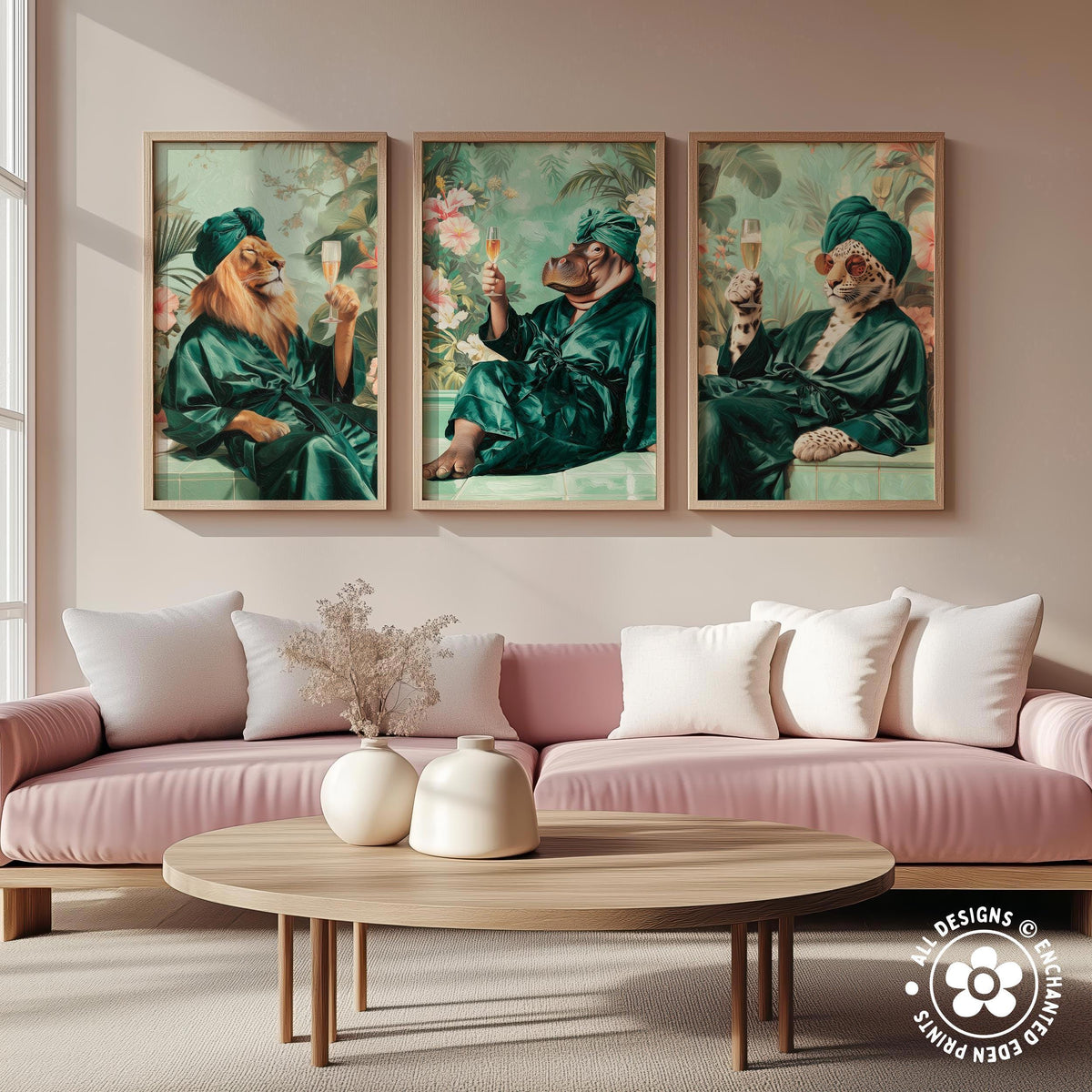three framed artworks depicting animals in green robes, each holding a wine glass, arranged on a wall above a pink couch in a living room setting.