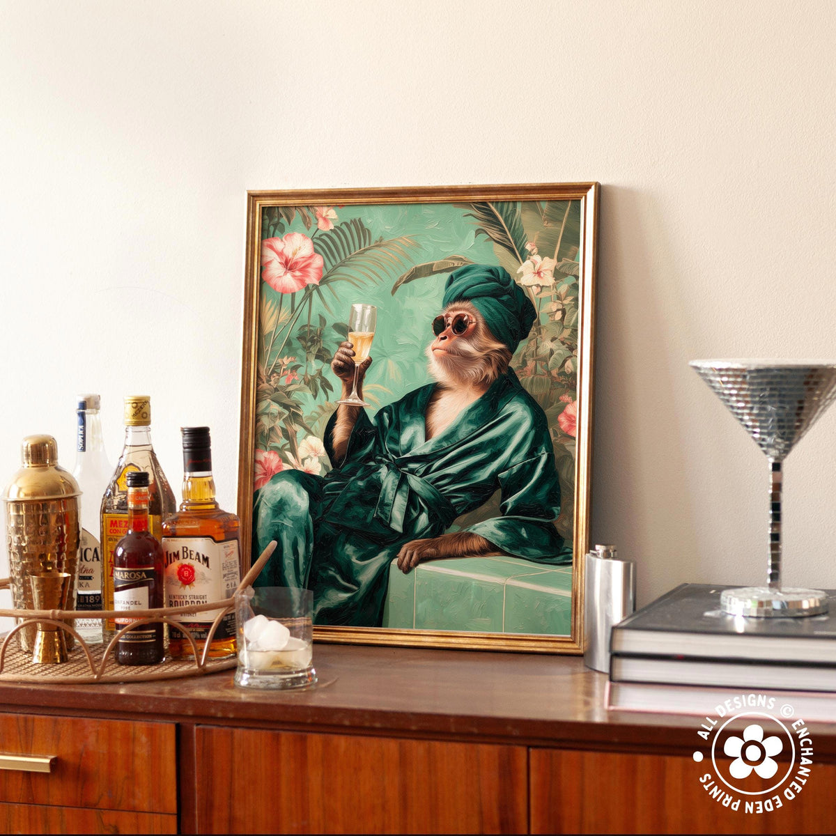 a framed painting of a monkey dressed in a green robe and holding a glass of wine, sitting on a bench and holding a cocktail glass.