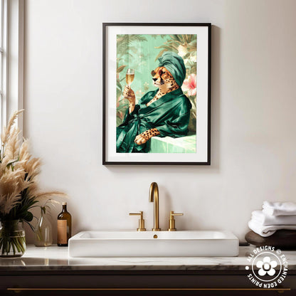 a framed painting of a cheetah wearing a green robe and holding a glass of wine, set against a tropical background.