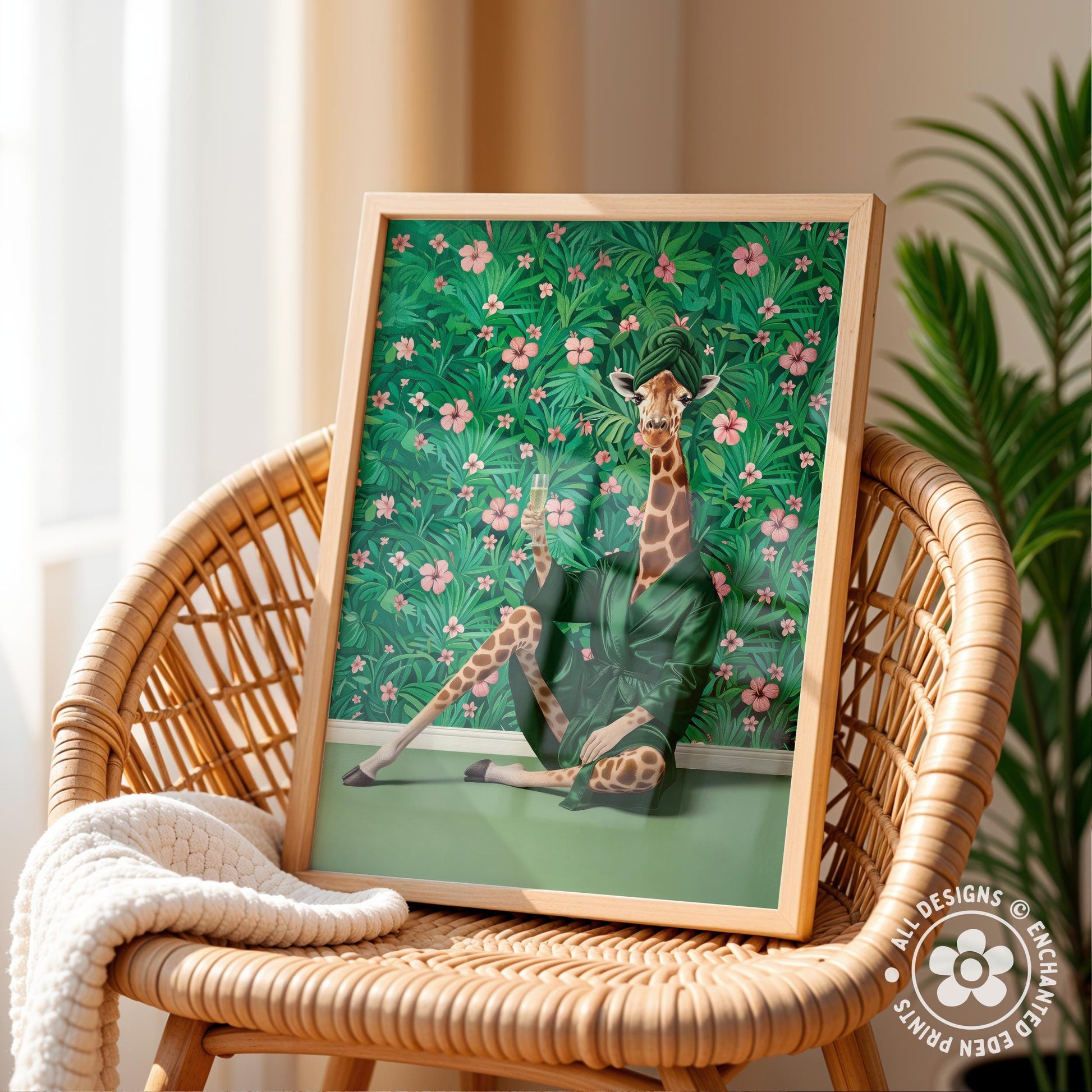 A framed illustration of a giraffe sitting in a green bathtub surrounded by a tropical floral background, placed on a wicker chair.