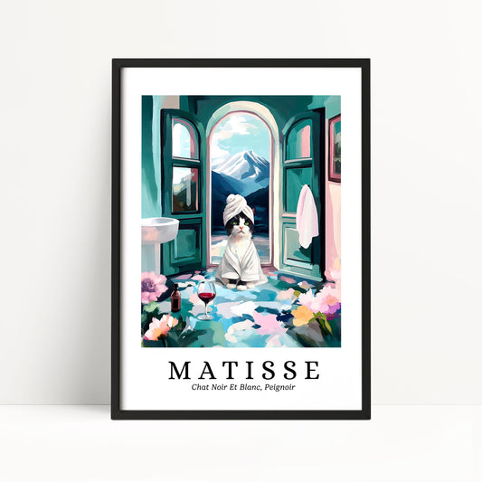A framed poster depicting a cat sitting in a bathroom with a towel wrapped around its head, surrounded by flowers and a mountain landscape.