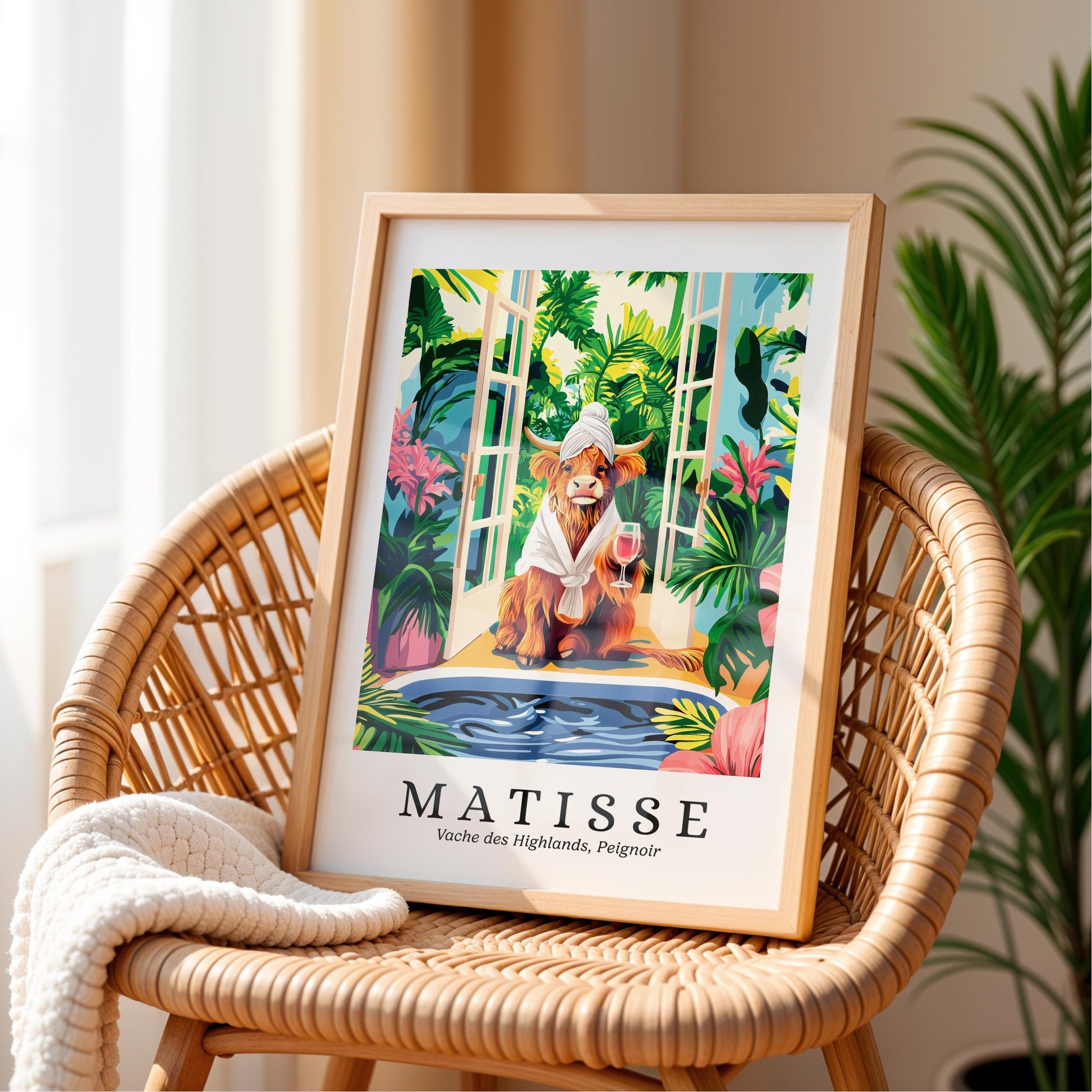 A framed illustration of a cow wearing a white towel and holding a wine glass, set against a tropical background with palm trees and other lush foliage.