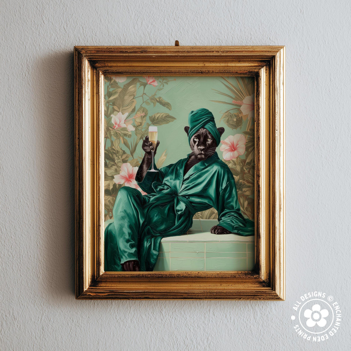 A framed painting depicting a cat wearing a green robe and holding a glass of champagne, with a tropical floral background.