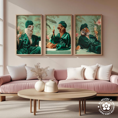 a living room with a pink sofa and a wooden coffee table. Above the sofa, there are three framed paintings depicting animals in green robes, including a lion, a tiger, and a llama.