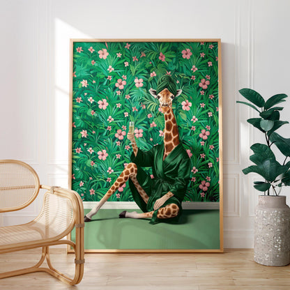 A giraffe wearing a green robe is sitting on a green surface, holding a glass of wine, with a lush green background featuring pink flowers.