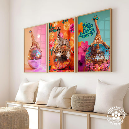 a set of three paintings of giraffes on a wall