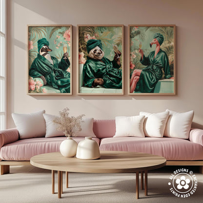 a cozy living room with a pink sofa, a wooden coffee table, and three framed paintings of animals in green robes.
