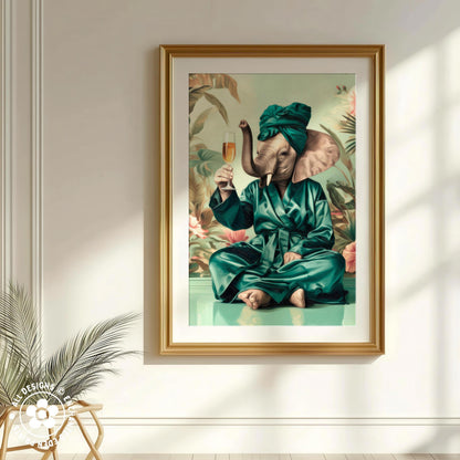 A framed painting depicting an elephant dressed in a green robe and holding a glass of champagne, sitting on a green surface surrounded by tropical foliage.